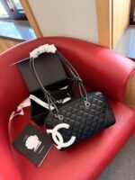 Chanel camera bag, size 28 × 10 × 16