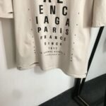 Balenciaga distressed-style T-shirt with eye chart letter print and loose fit. - Image 6