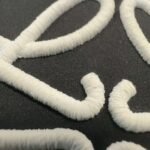 Loewe embroidered black down jacket - Image 8