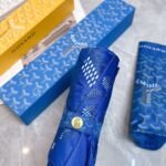 Goyard tri-fold sun-protective umbrella has a black inner coating that effectively blocks 99% of UV rays. - Image 13