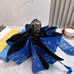 Goyard tri-fold sun-protective umbrella has a black inner coating that effectively blocks 99% of UV rays. - Image 12