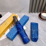 Goyard tri-fold sun-protective umbrella has a black inner coating that effectively blocks 99% of UV rays. - Image 9