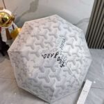 Goyard tri-fold sun-protective umbrella has a black inner coating that effectively blocks 99% of UV rays. - Image 2