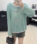 Celine’s new spring/summer green and white striped smiley face round neck long-sleeved knit sweater