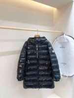 MONCLER’s latest winter collection: Women’s mid-length hooded down jacket. - Image 11