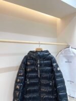 MONCLER’s latest winter collection: Women’s mid-length hooded down jacket. - Image 10