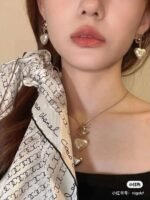 Chanel light gold heart heart earrings - Image 6