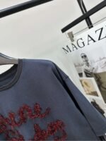 Acne Studios Series of faux two-piece long-sleeved T-shirts, dark gray base with red glitter embroidery. - Image 7