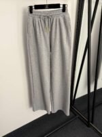 Schiaparelli’s new tracksuit with gold button embellishments - Image 14