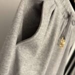 Schiaparelli’s new tracksuit with gold button embellishments - Image 12