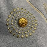 Schiaparelli’s new tracksuit with gold button embellishments - Image 10