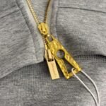 Schiaparelli’s new tracksuit with gold button embellishments - Image 9