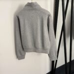 Schiaparelli’s new tracksuit with gold button embellishments - Image 8