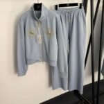 Schiaparelli’s new tracksuit with gold button embellishments - Image 6