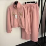 Schiaparelli’s new tracksuit with gold button embellishments - Image 5
