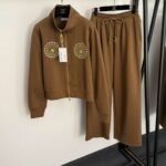 Schiaparelli’s new tracksuit with gold button embellishments - Image 4