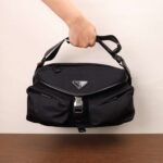 PRADA The new messenger bag features a flap design and adjustable shoulder strap. SIZE:27x18x7cm - Image 3