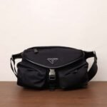 PRADA The new messenger bag features a flap design and adjustable shoulder strap. SIZE:27x18x7cm